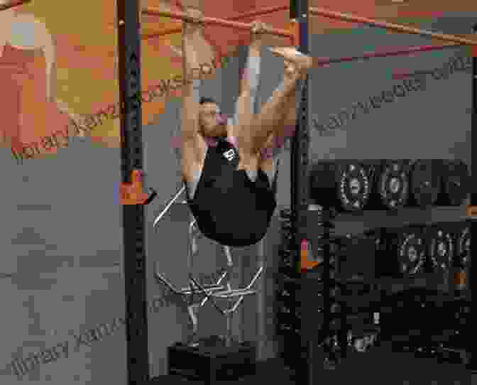 A Man Performing Hanging Leg Raises On A Pull Up Bar Lower Ab Exercises For Men And Women: Best Lower Ab Exercises At Home