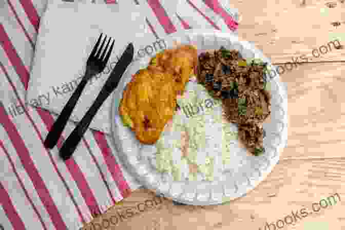 A Sizzling Plate Of Haitian Meat Dish With Colorful Vegetables Cook Like A Haitian: 7 Easy Meat Recipes