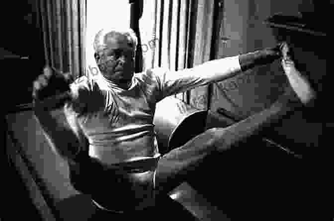 Joseph Pilates, The Founder Of Pilates, Practicing His Exercises The Pilates Power System